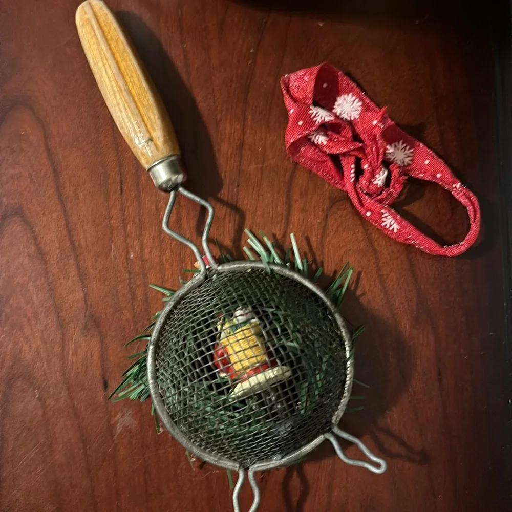 Handmade Santa Holiday Wreath on an old tea strainer.